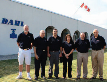 A photo of Dahl Valve sales agents standing in front of Dahl factory in Mississauga, Ontario